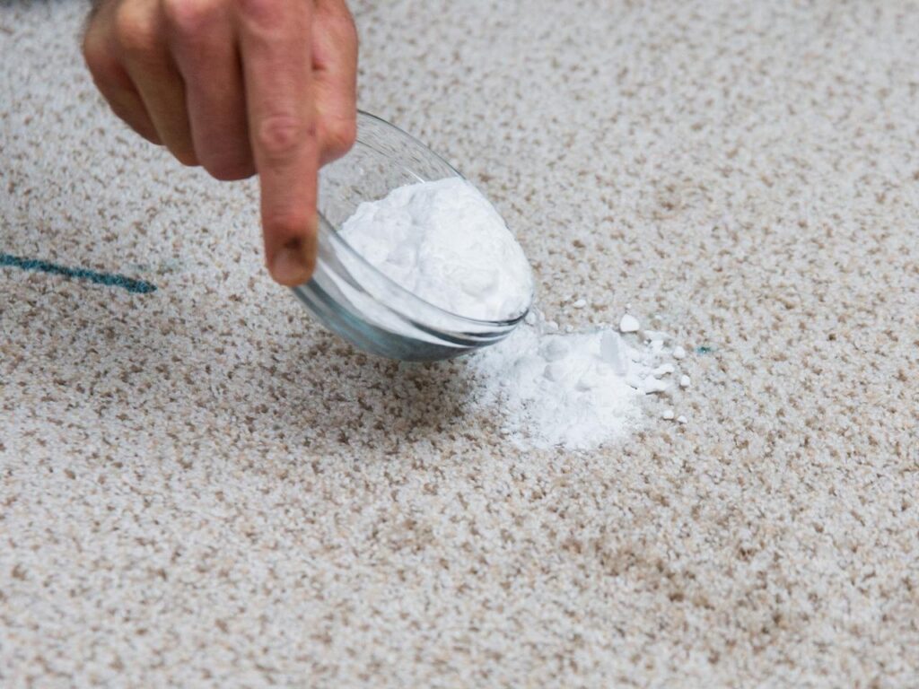 remove greasy stains using baking soda