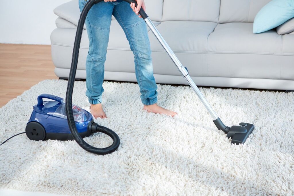 vacuuming carpets