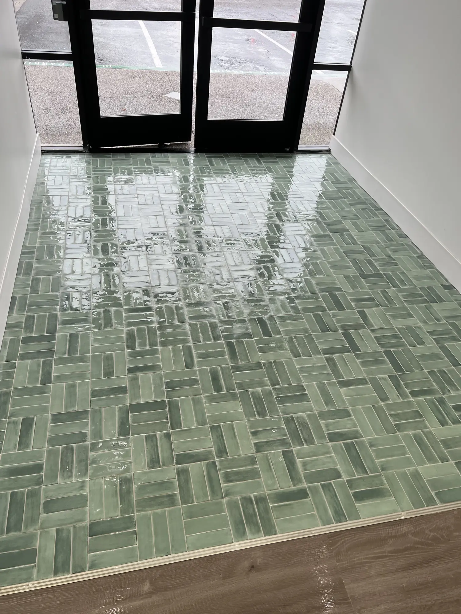 Freshly cleaned and polished commercial entryway tile and grout flooring in San Diego