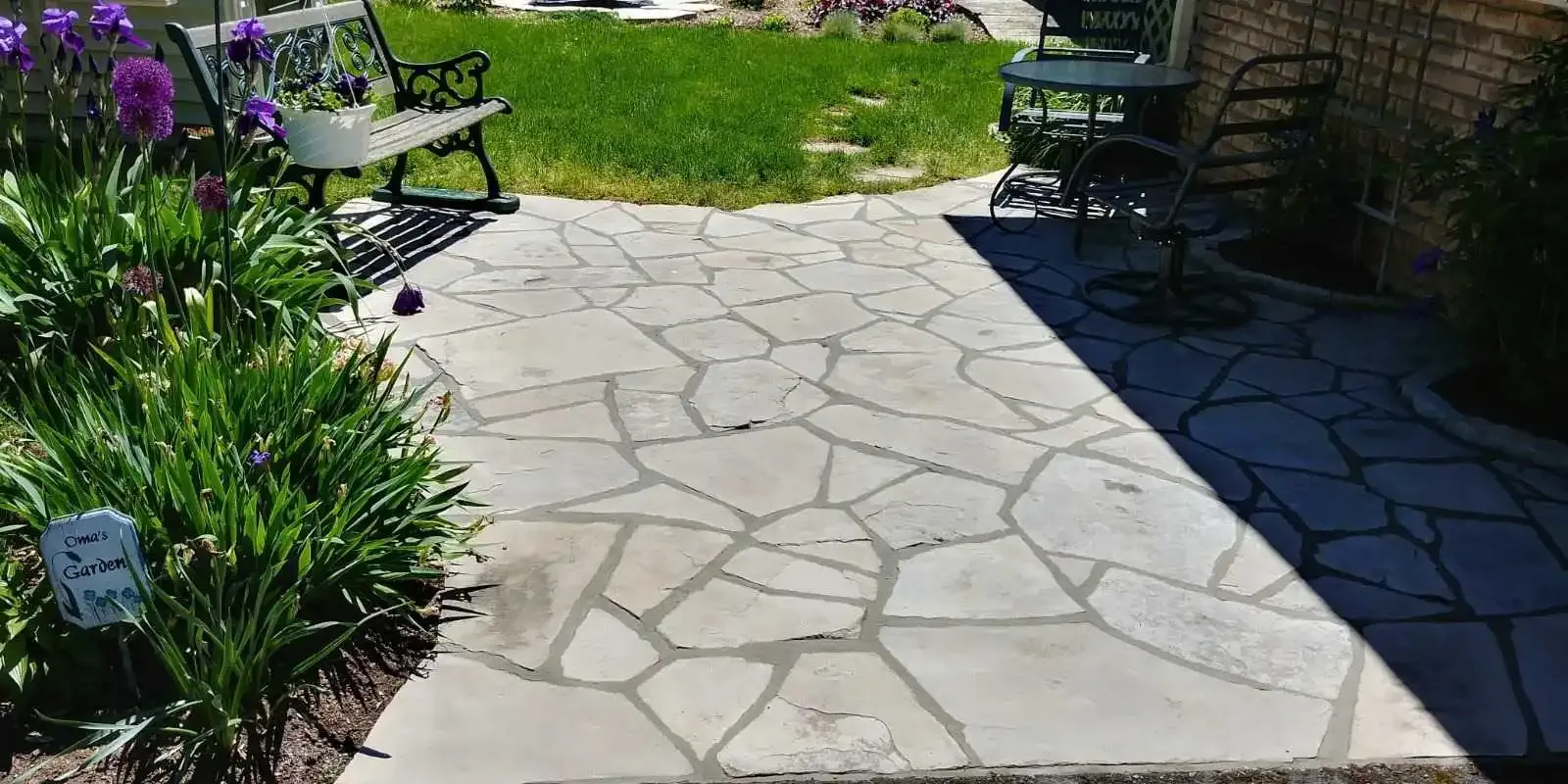 Restored and sealed outdoor flagstone patio following professional natural stone cleaning service